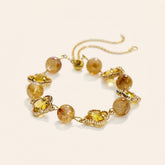 natural citrine clover bracelet with golden crystal clover charms symbolizing abundance and wealth