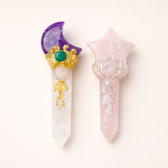 Two decorative crystal sticks with gemstones on a white background