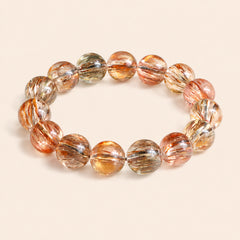 Natural Black Gold Rutilated Quartz bracelet with glossy round crystal beads