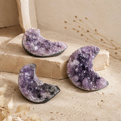 Natural Amethyst Crescent Moon crystals with unique natural formations, purple tones, and raw cluster texture.