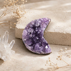 Natural Amethyst Crescent Moon crystal cluster styled with soft neutral decor for calm and new beginnings.
