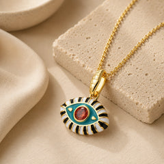 18K gold plated evil eye pendant necklace with aqua enamel and red zircon center stone.