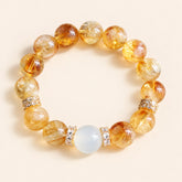Natural citrine bracelet with golden crystal beads, white center bead and sparkling spacers