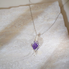 Witchlight crystal necklace displayed on ritual altar