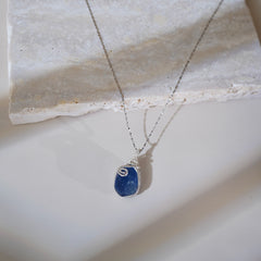 Deep blue fluorite crystal pendant on minimalist silver chain