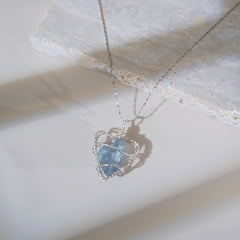 Tranquil blue gemstone pendant inspired by ocean waves