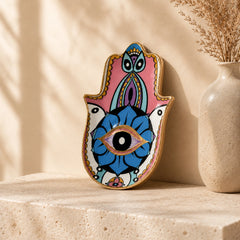 Pastel Hamsa Evil Eye Ceramic Trinket Dish with glossy finish displayed as spiritual protection decor on a neutral shelf.