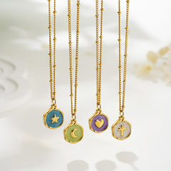 Colorful moon pendant necklace in gold symbolizing calm and feminine energy