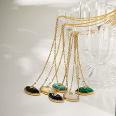 Tiger’s eye evil eye pendant in 18K gold for grounding and strength