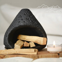 Black ceramic smudge bowl designed for incense and ritual smoke cleansing.
