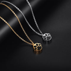 gold and silver paw print cremation necklace for pet ashes
