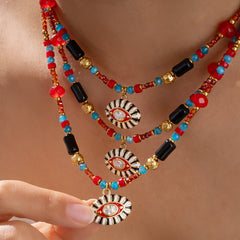 Evil eye charm necklace on model, spiritual and bold look