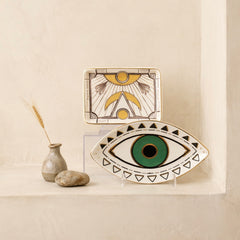 green evil eye ceramic tray styled as spiritual home decor