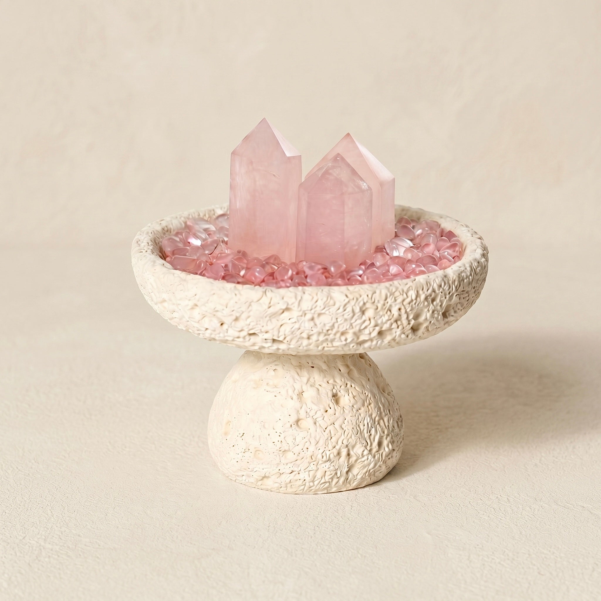 white nordic crystal cleansing bowl styled with rose quartz and cleansing stones
