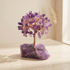 Feng shui crystal tree with amethyst gemstone leaves and natural amethyst base for harmony, luck and protection