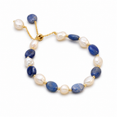 Blue aventurine and freshwater pearl bracelet isolated on a white background