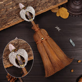 Rose quartz witch broom with angel wing charm for heart healing ceremonies