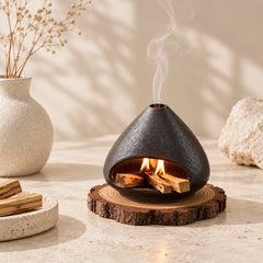 Fired Earth Brown ceramic Palo Santo burner styled on a wood slice in a warm neutral meditation space