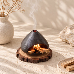 Fired Earth Brown ceramic Palo Santo and sage burner in a warm Wabi-Sabi interior with Palo Santo sticks