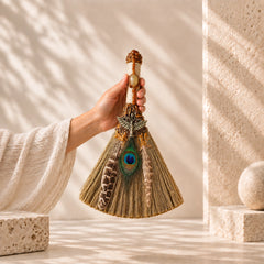 Handmade Citrine peacock feather witch broom styled in a warm neutral setting