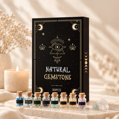 Crystal Starter Kit contents overview with 30 labeled mini gemstone bottles, Flower of Life grid, selenite stick and crystal guide