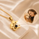 Gold custom pet photo projection necklace shown with a pet and owner keepsake image