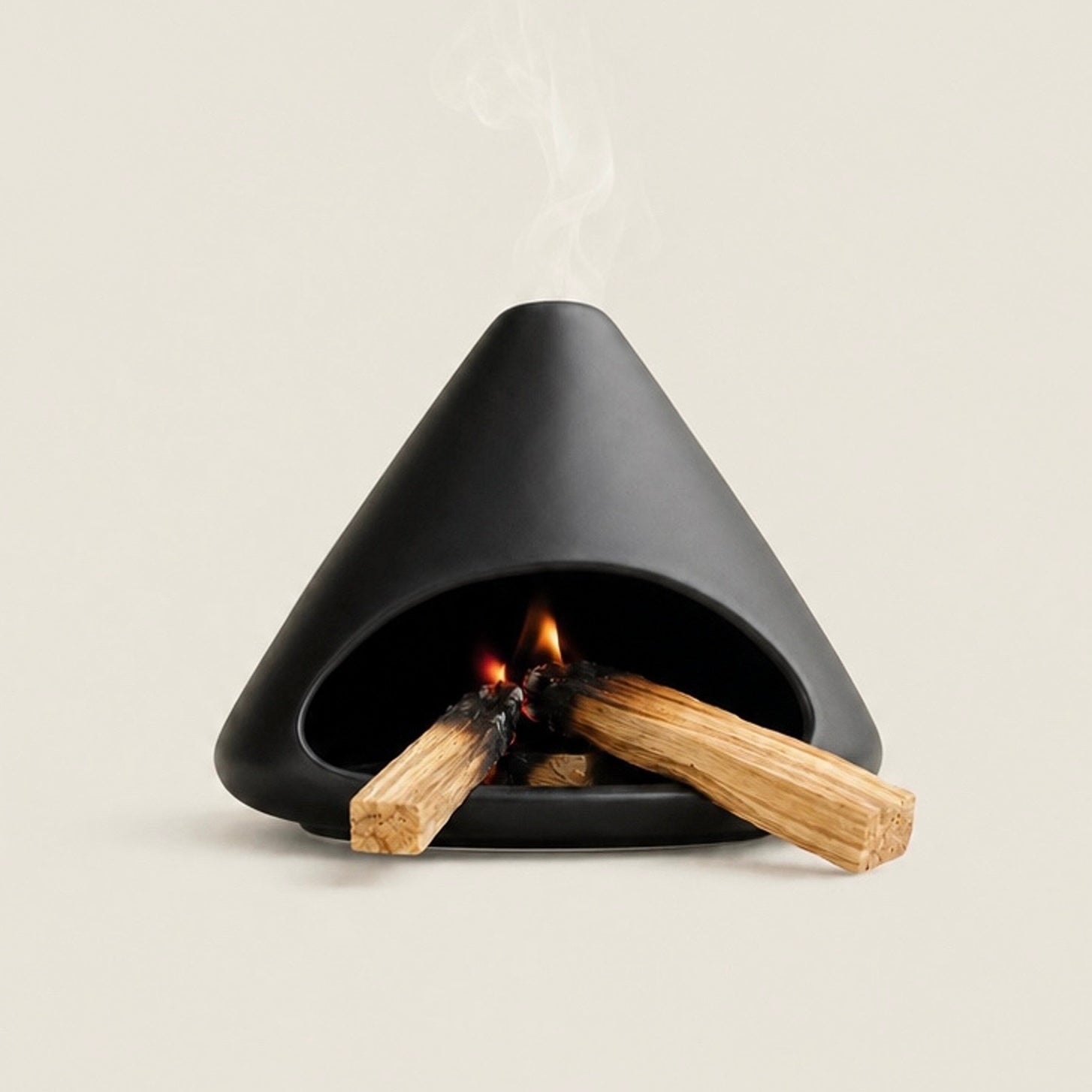 Black ceramic Palo Santo and sage burner with open hearth and top smoke vent for energy-cleansing rituals