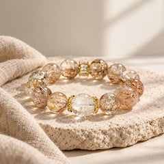 Black Golden Super Seven stretch bracelet with polished round crystal beads and natural dark and golden inclusions.