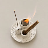 White Wabi-Sabi concrete cleansing burner holding Palo Santo and incense for a smoke-cleansing ritual