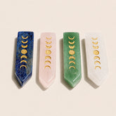Moon phase crystal wands in Lapis Lazuli, Rose Quartz, Green Aventurine, and Clear Quartz with gold lunar engravings