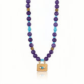 Close-up of an Evil Eye Amethyst & Turquoise Necklace with a gold-plated pendant.