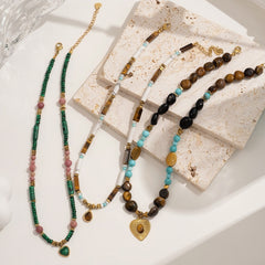 Close-up of bohemian style energy necklace with natural stones