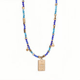 Evil Eye pendant necklace made with natural blue stone beads