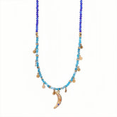 Crescent moon charm necklace with gold-tone chain and turquoise stones