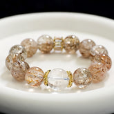 Bracelet with brown and clear beads on a white surface