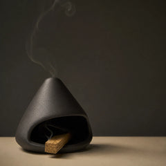 Mount Fuji Ceramic Incense Burner holding Palo Santo with soft smoke for calm energy cleansing.