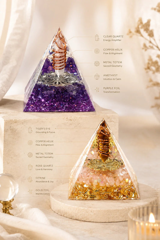 Two orgonite pyramids with amethyst, clear quartz, tiger’s eye, copper helix, rose quartz, citrine, and gold foil details