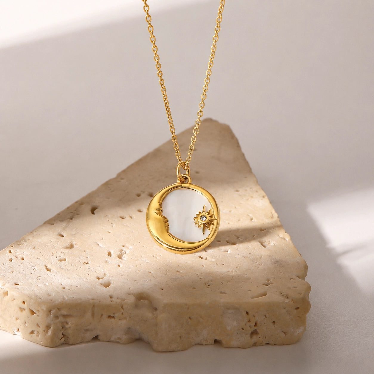 Moon and Star shell necklace shown from the front with crescent pendant