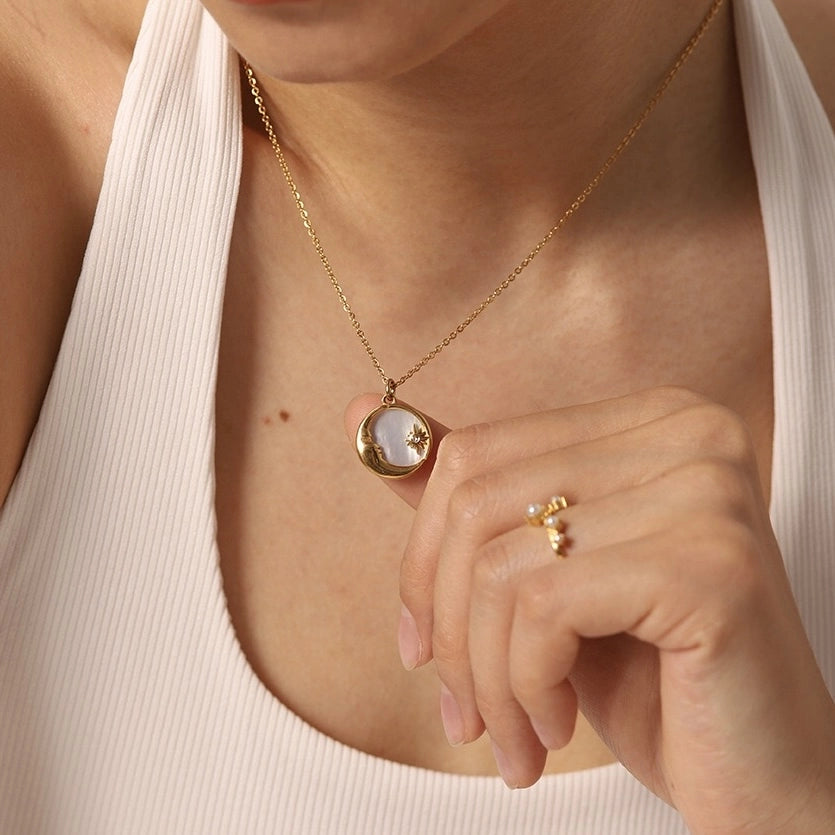 Model wearing a Moon and Star shell necklace with crescent pendant