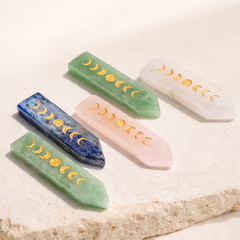 Natural crystal wand engraved with moon phases for emotional balance