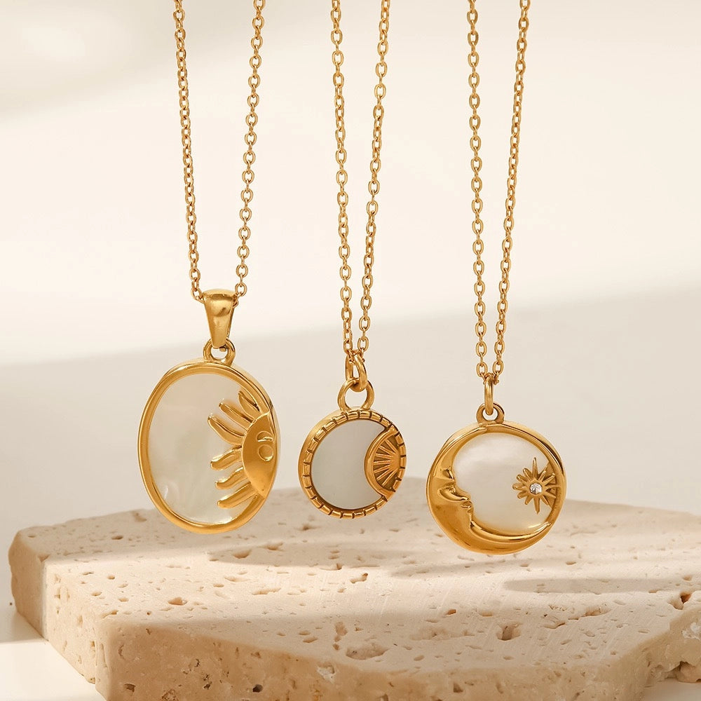 Three Sun and Moon shell necklace styles displayed together