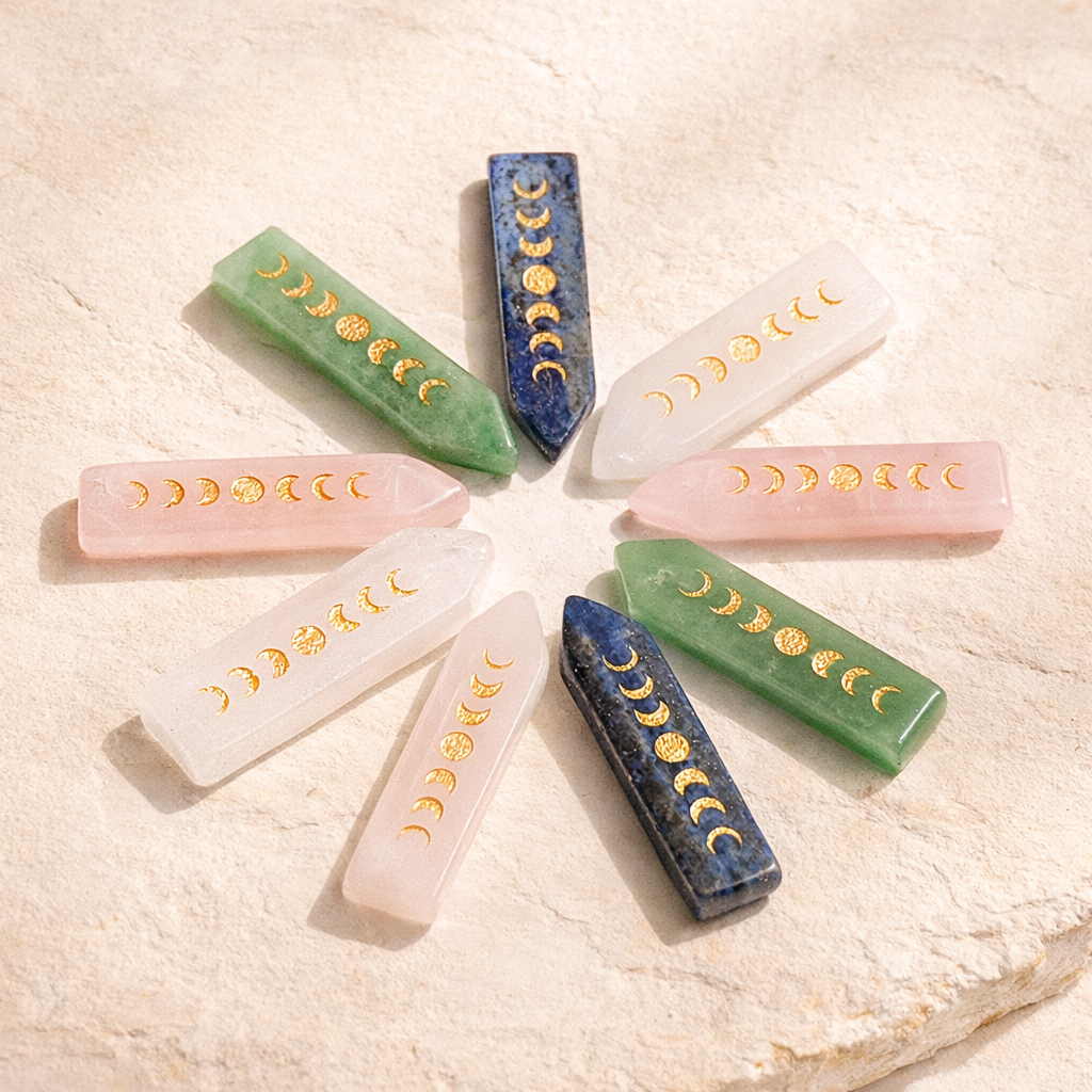Moon phase crystal wand with gold engraved lunar symbols