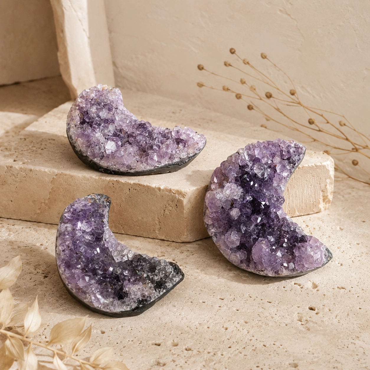 Natural Amethyst Crescent Moon crystals with unique natural formations, purple tones, and raw cluster texture.