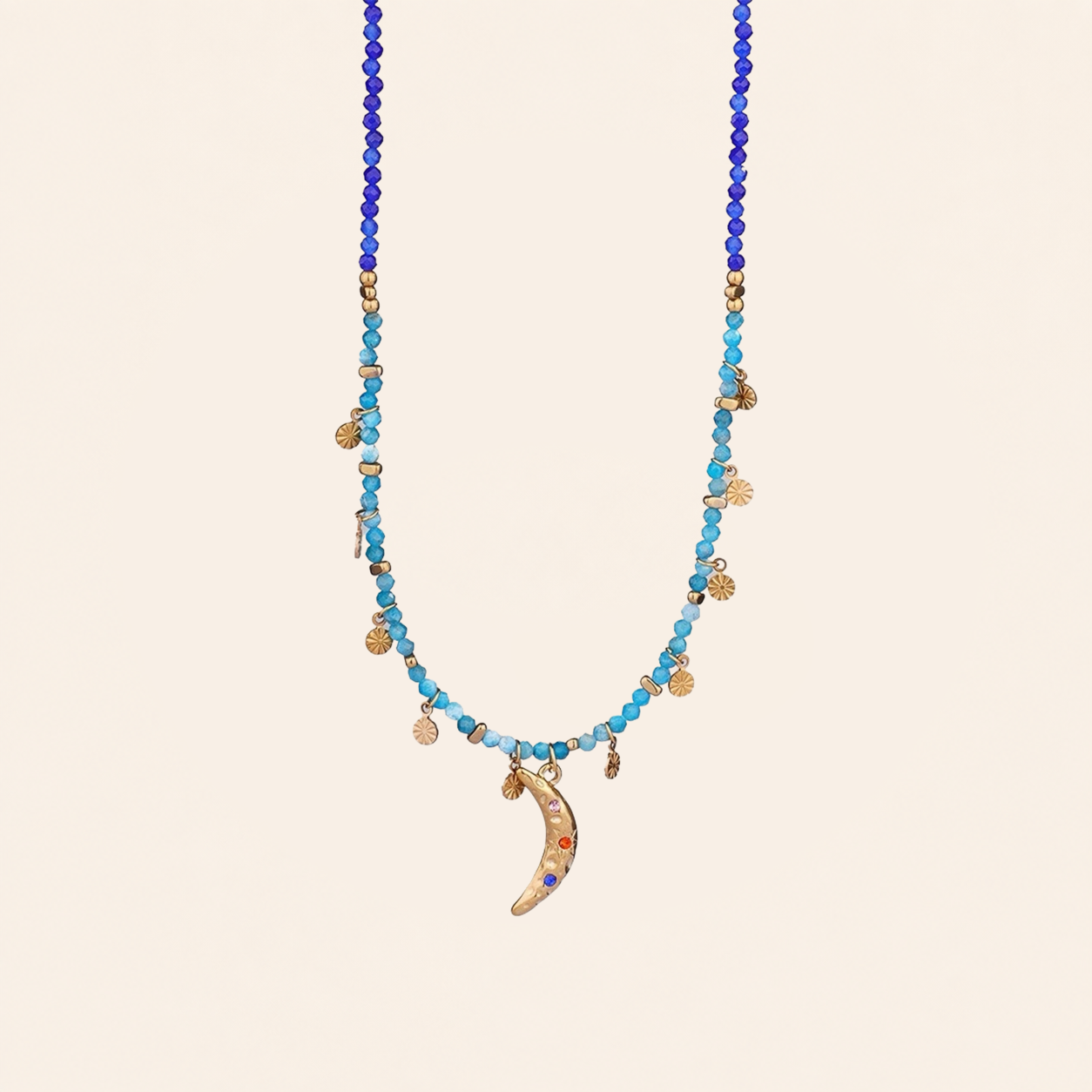 Crescent moon charm necklace with gold-tone chain and turquoise stones