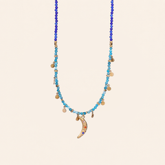 Crescent moon charm necklace with gold-tone chain and turquoise stones