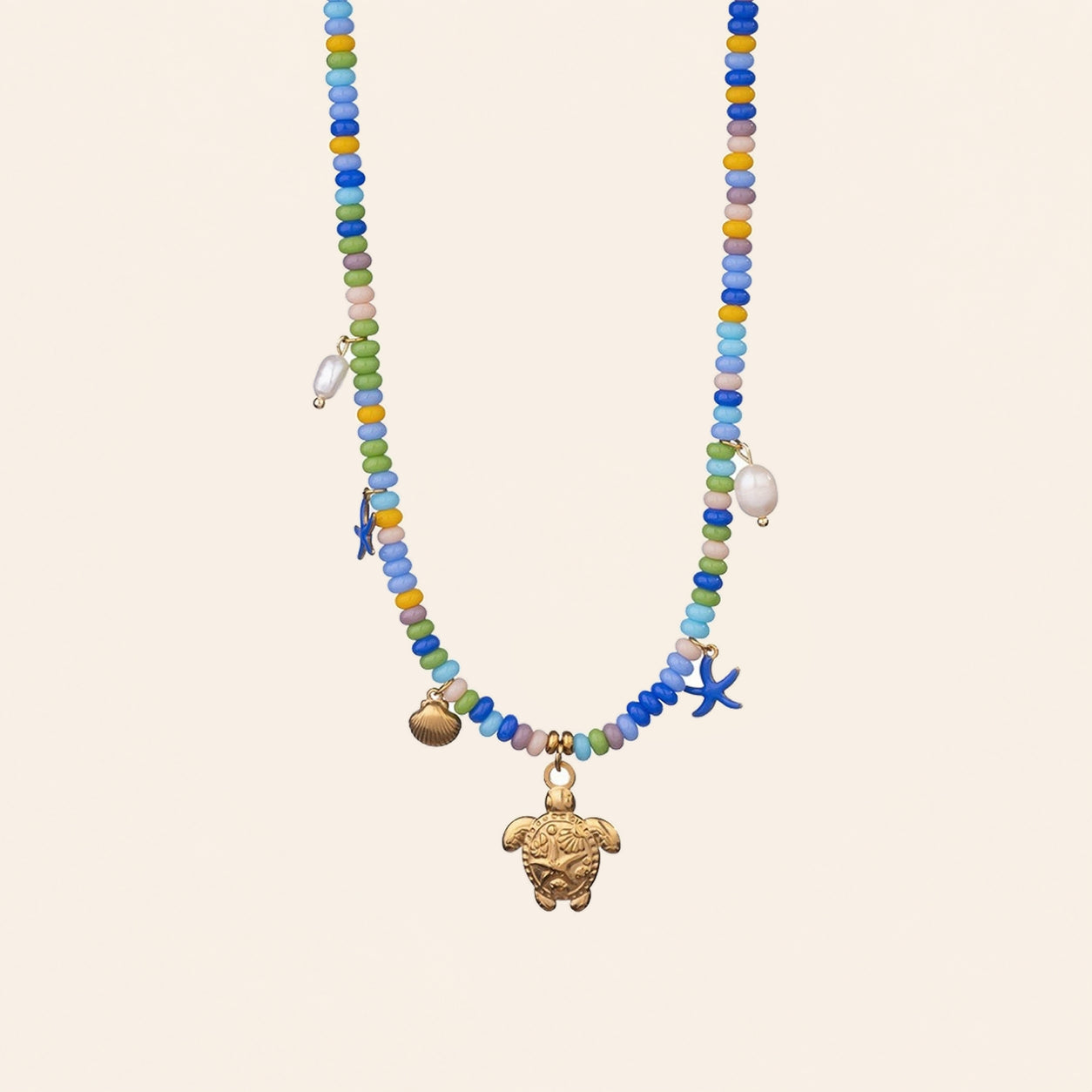 Sea turtle beaded necklace with gold turtle, shell and blue starfish charms