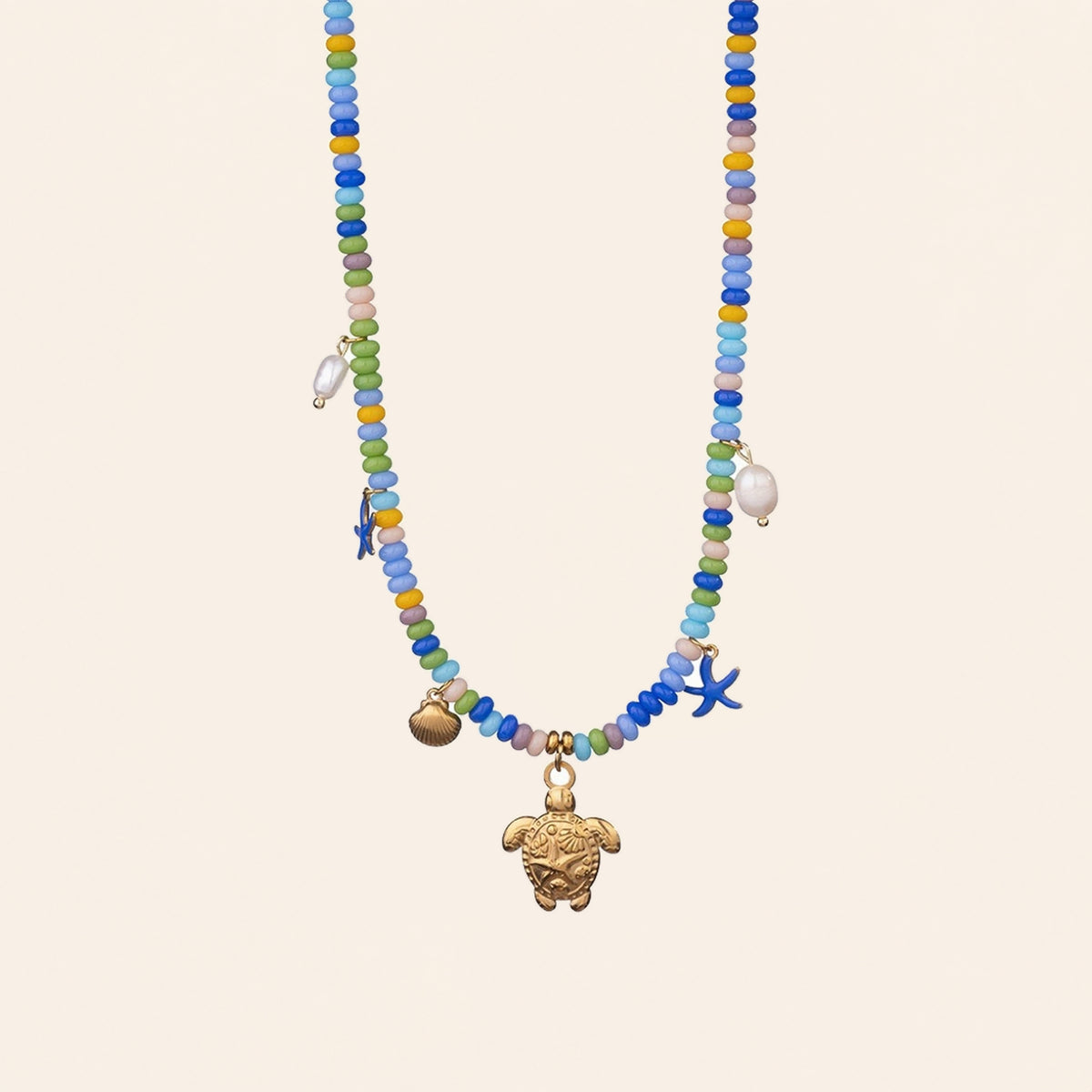 Sea turtle beaded necklace with gold turtle, shell and blue starfish charms