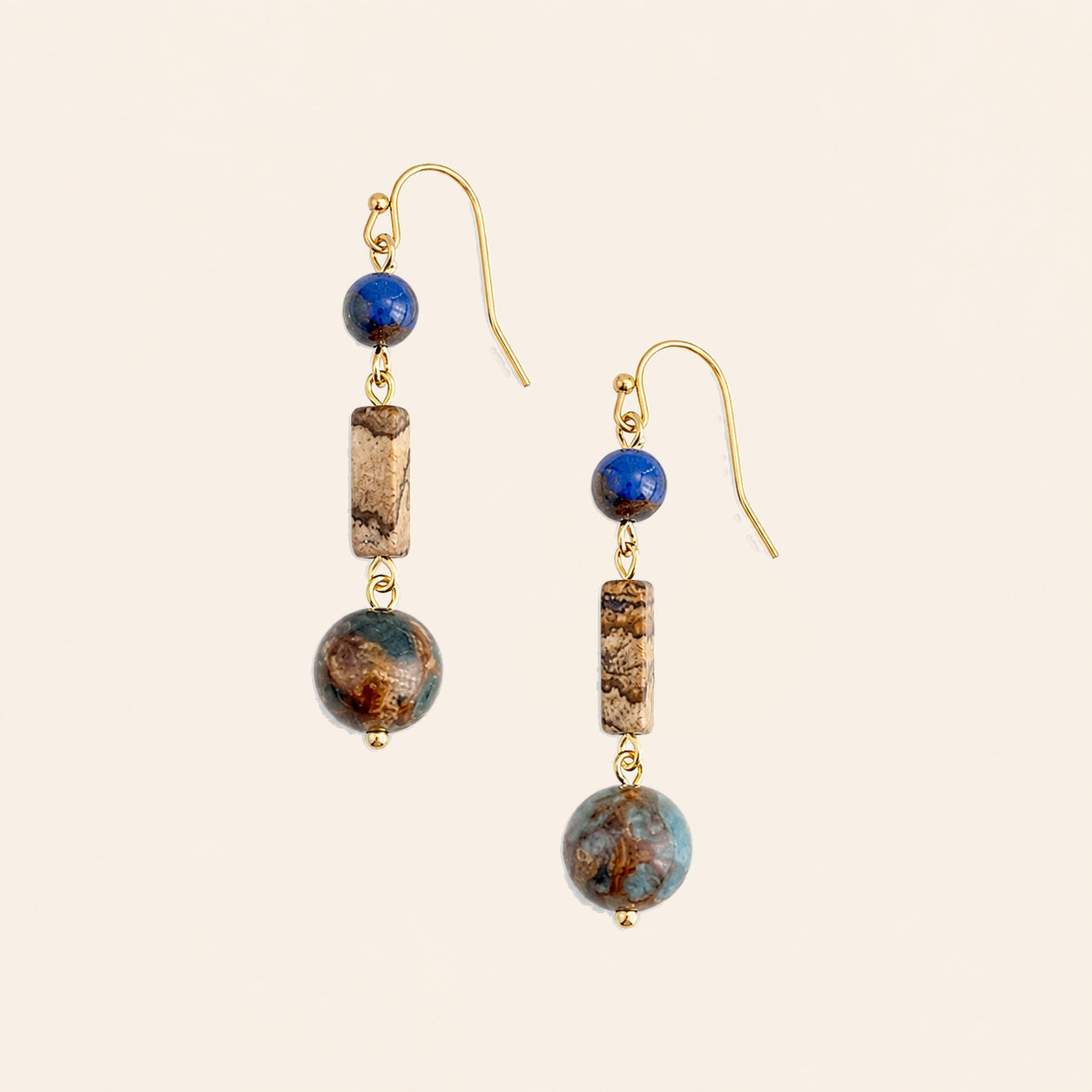 lapis lazuli handmade earrings with copper ear hooks on nature background 