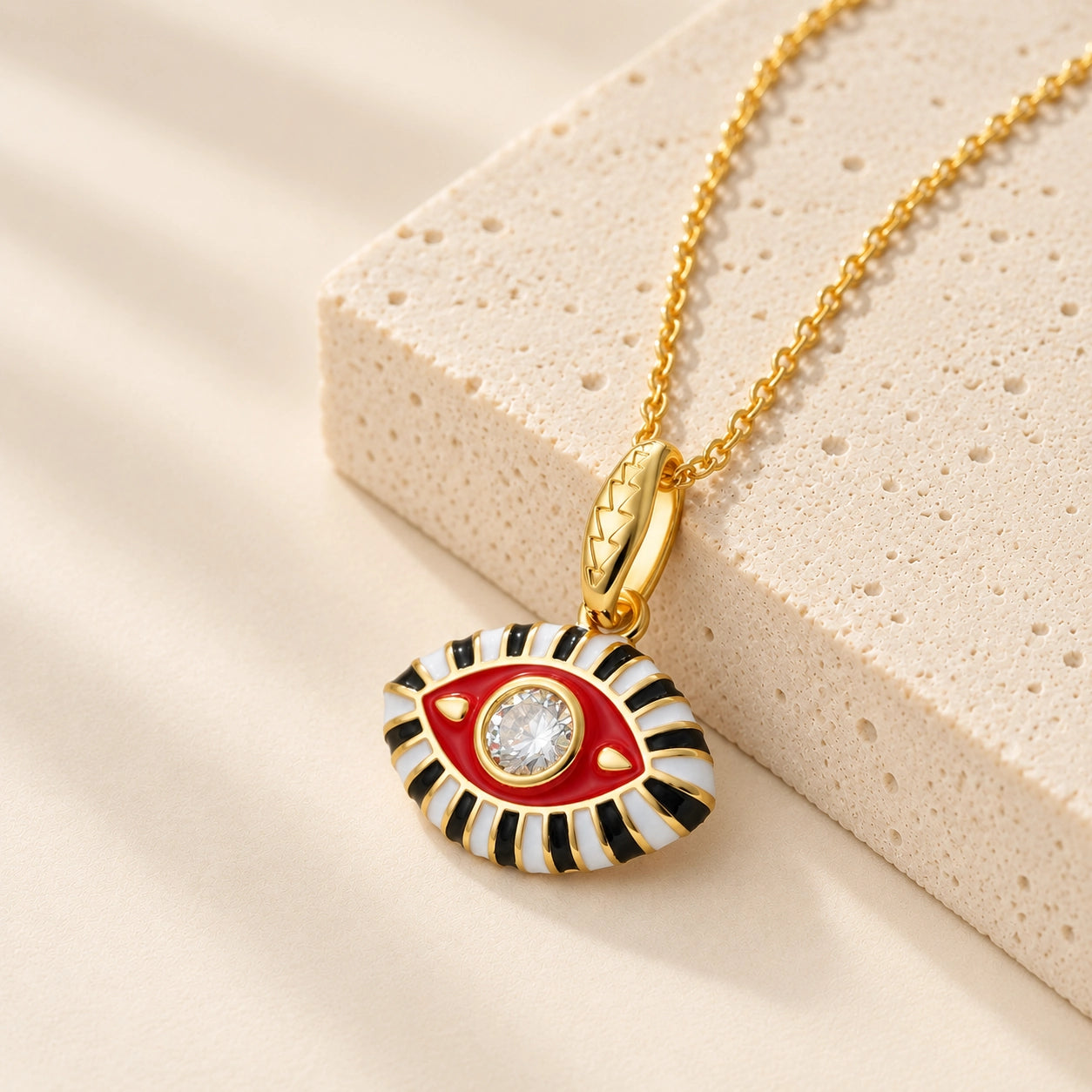 Red enamel evil eye pendant necklace with clear zircon center stone for protection and positivity.