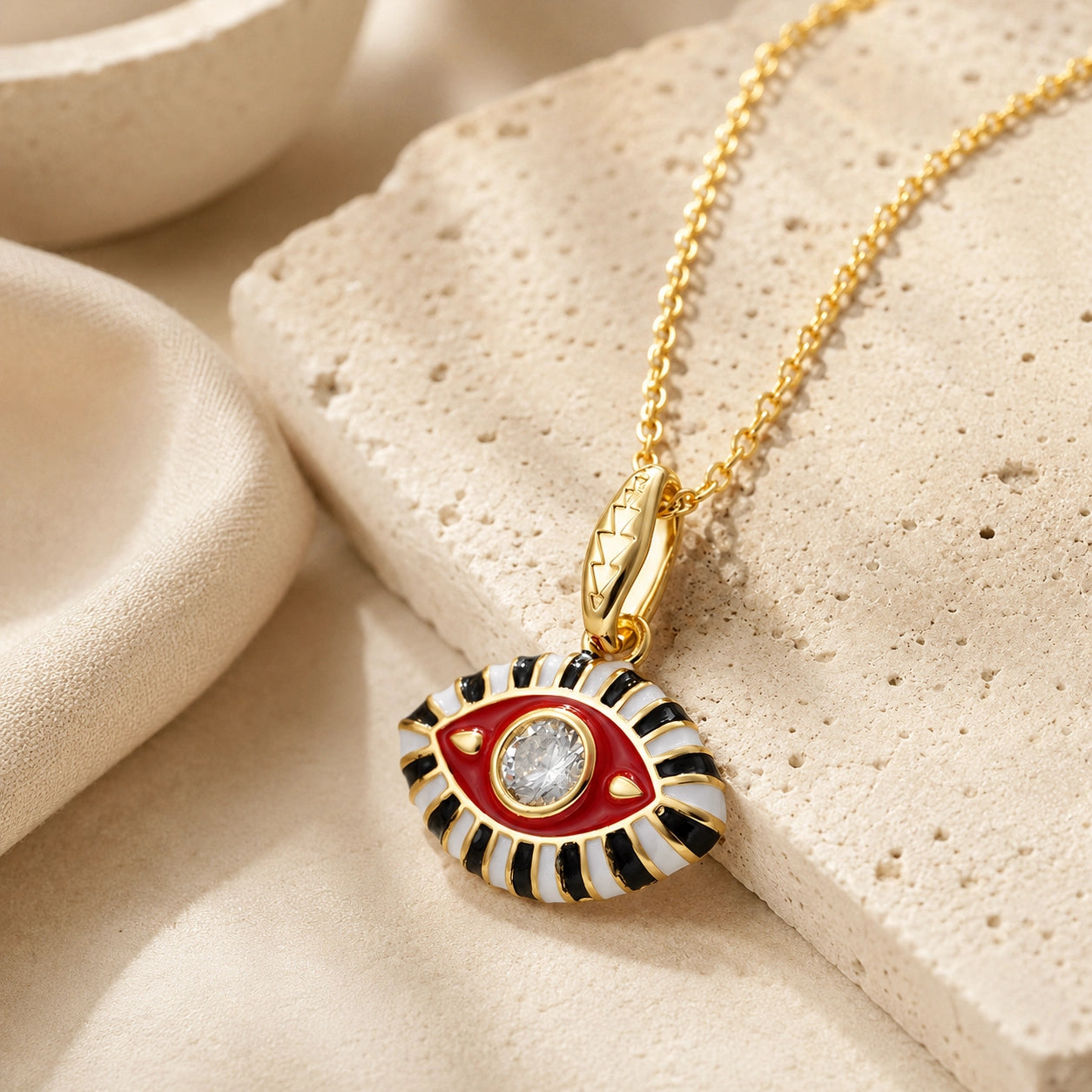 Red enamel evil eye pendant necklace with clear zircon center stone for protection and positivity.